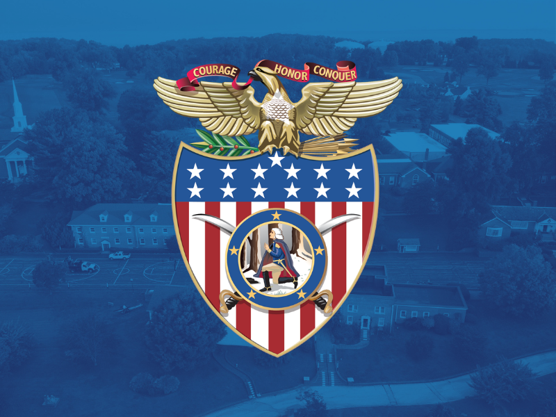 A crest with an eagle holding arrows and an olive branch, a banner reading “Courage Honor Conquer,” and a shield with stars, stripes, and a seated figure. The emblem is overlaid on a blue-tinted town background.